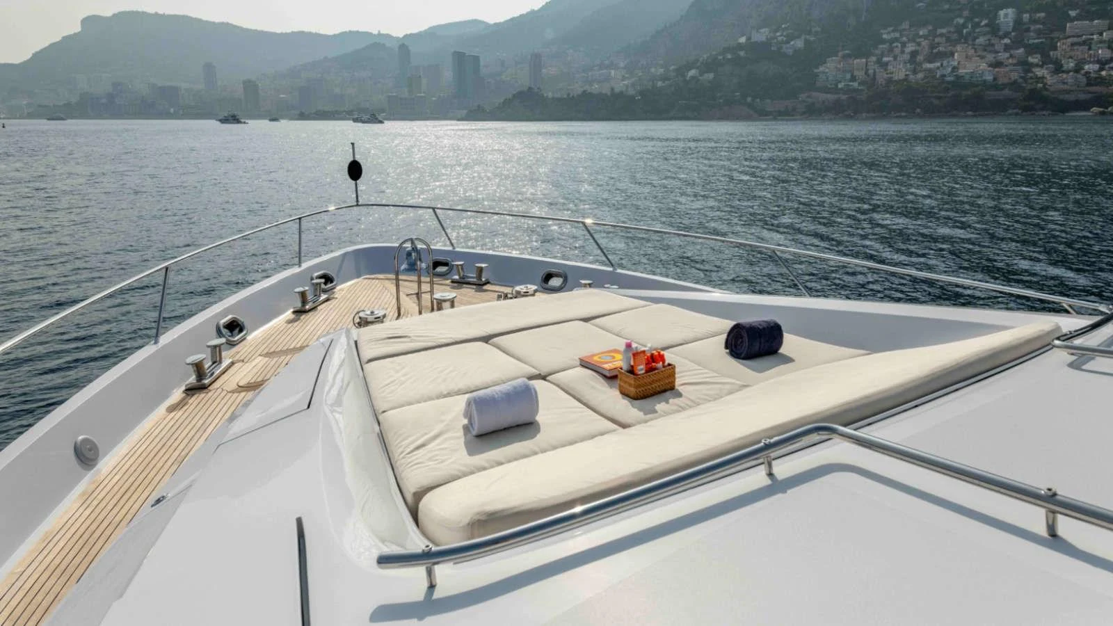 The foredeck features a luxurious sunbathing area with plush cushions and scenic views. aboard PALMER JOHNSON 150 Yacht for Sale