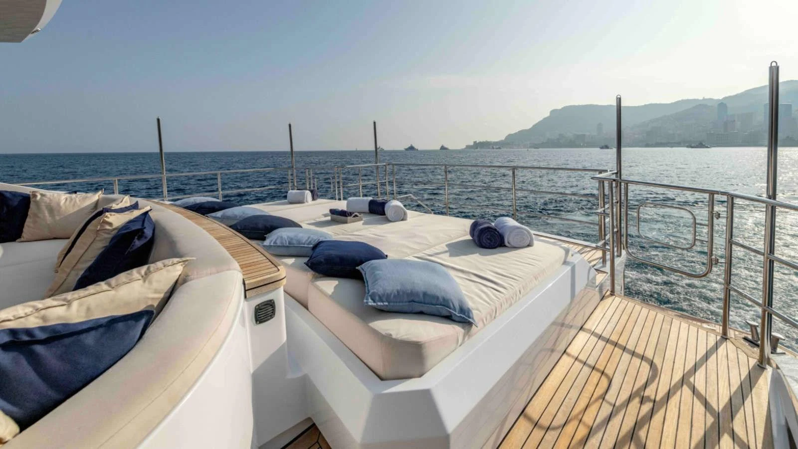 The sundeck offers luxurious lounging with plush sunbeds and stunning ocean views. aboard PALMER JOHNSON 150 Yacht for Sale