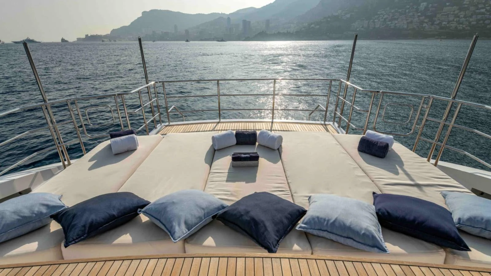 The sundeck offers a spacious lounging area with plush cushions and breathtaking ocean views. aboard PALMER JOHNSON 150 Yacht for Sale