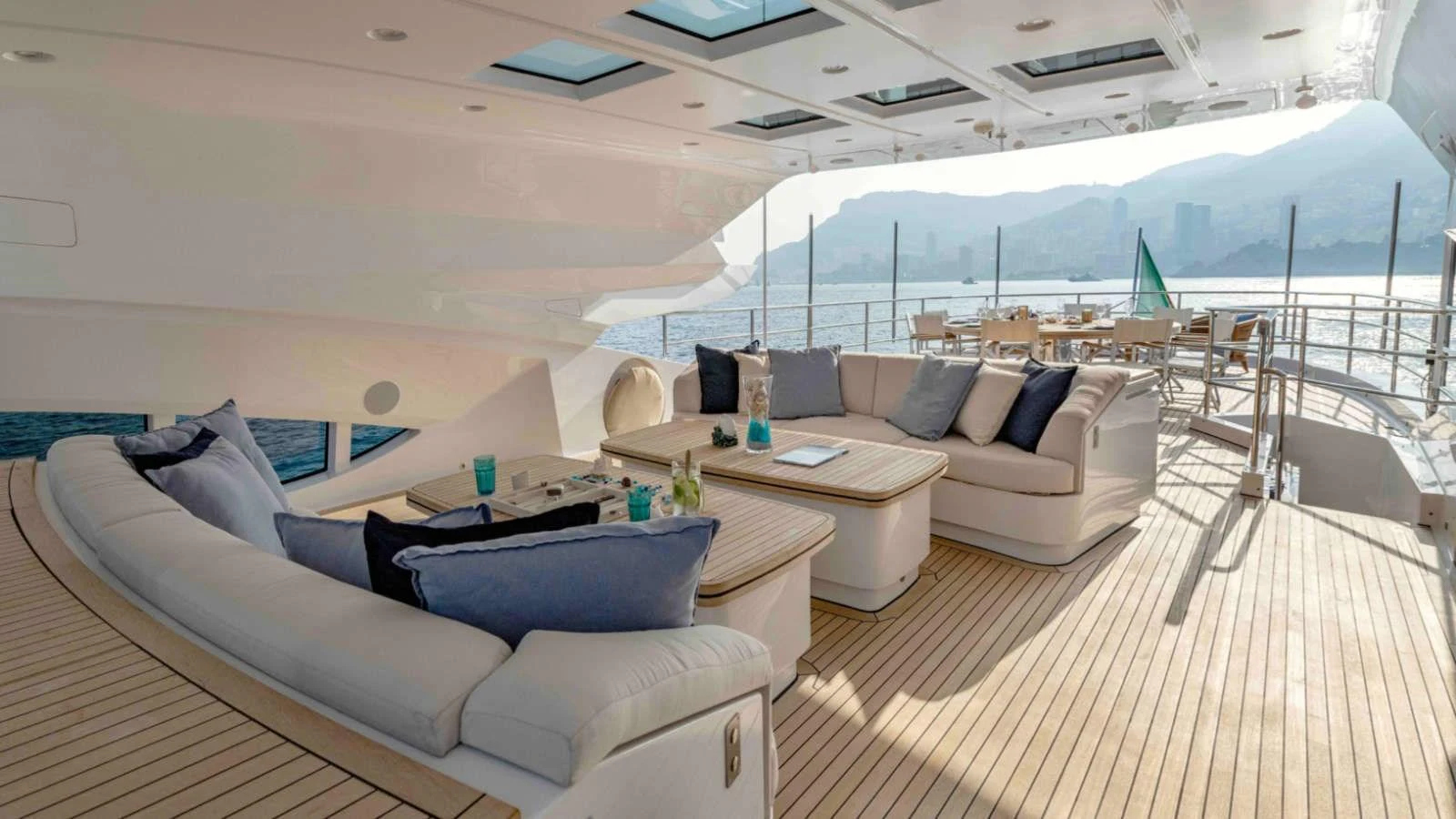 The aft deck features a spacious and luxurious seating area with panoramic views of the water. aboard PALMER JOHNSON 150 Yacht for Sale