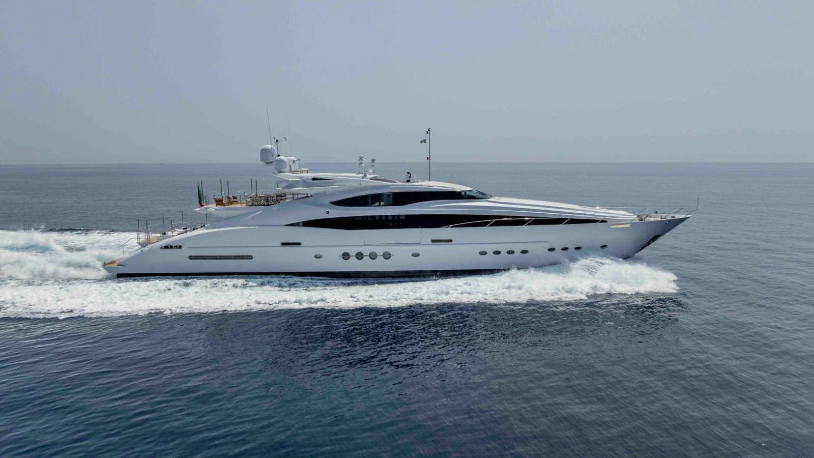 A sleek and modern yacht cruises swiftly across calm waters, showcasing its elegant design and powerful performance. aboard PALMER JOHNSON 150 Yacht for Sale
