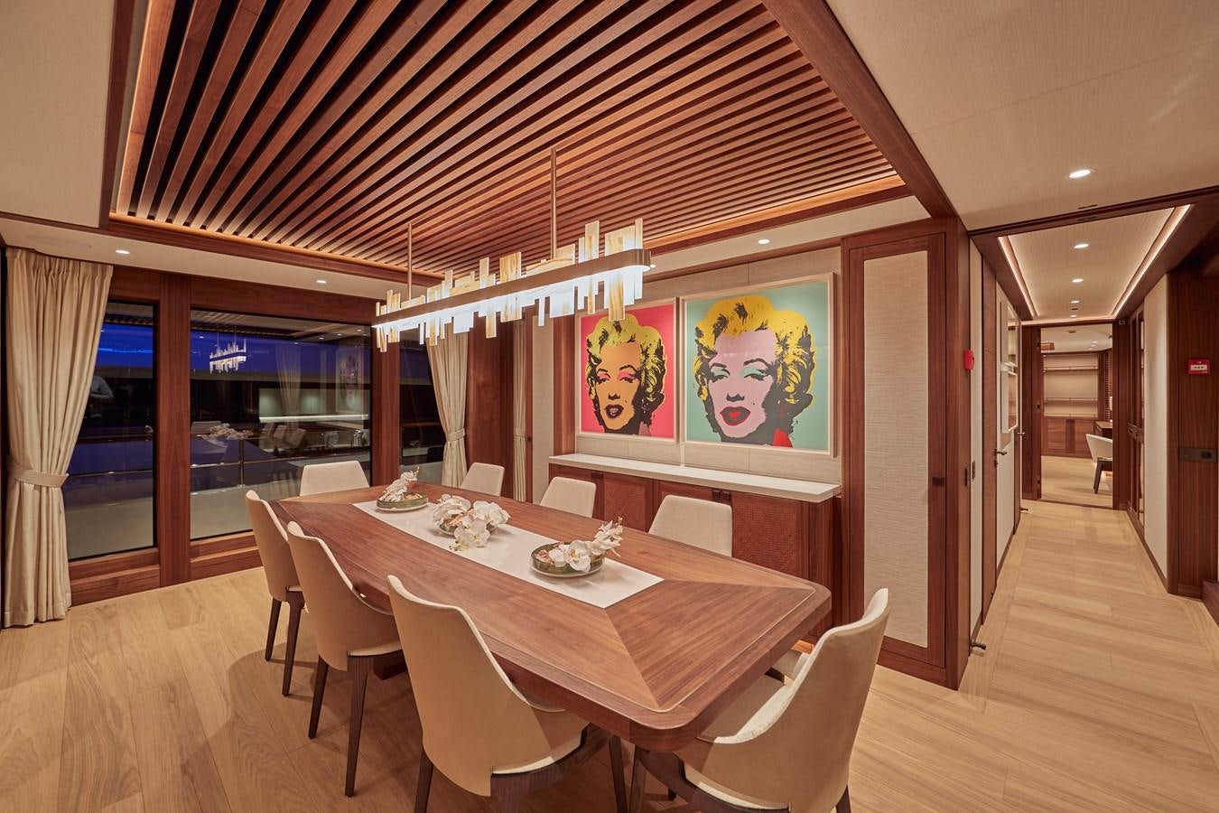 a dining table in a room aboard SOLEMATES V Yacht for Sale