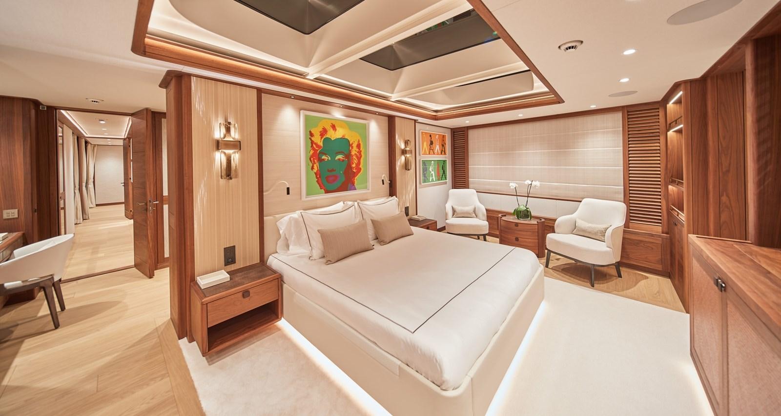 a room with a bed and a chair aboard SOLEMATES V Yacht for Sale