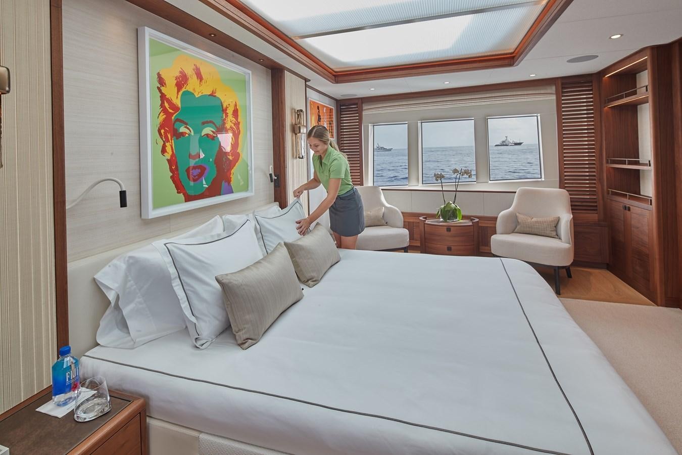 a person standing on a bed aboard SOLEMATES V Yacht for Sale