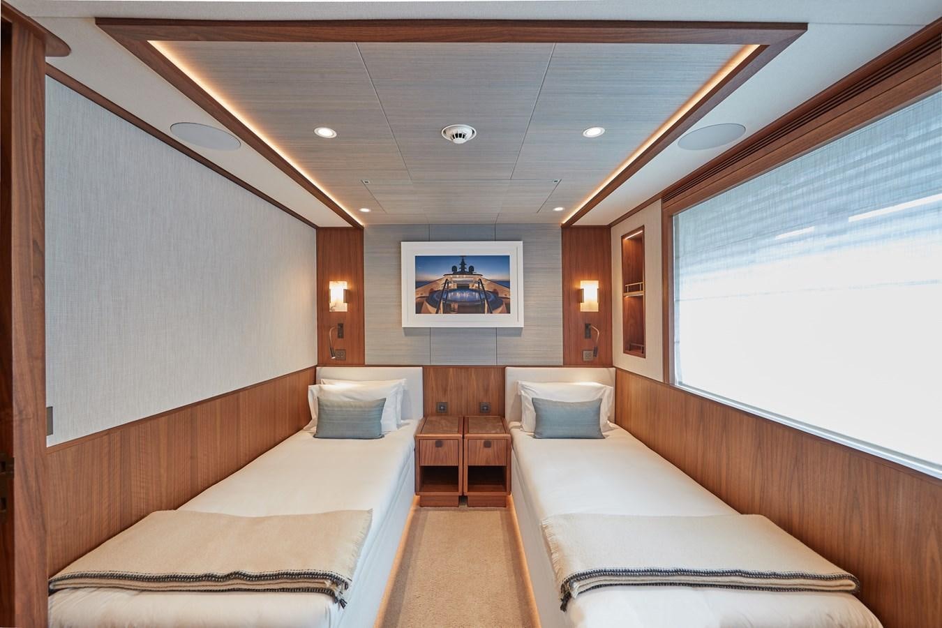 a room with a couple beds aboard SOLEMATES V Yacht for Sale