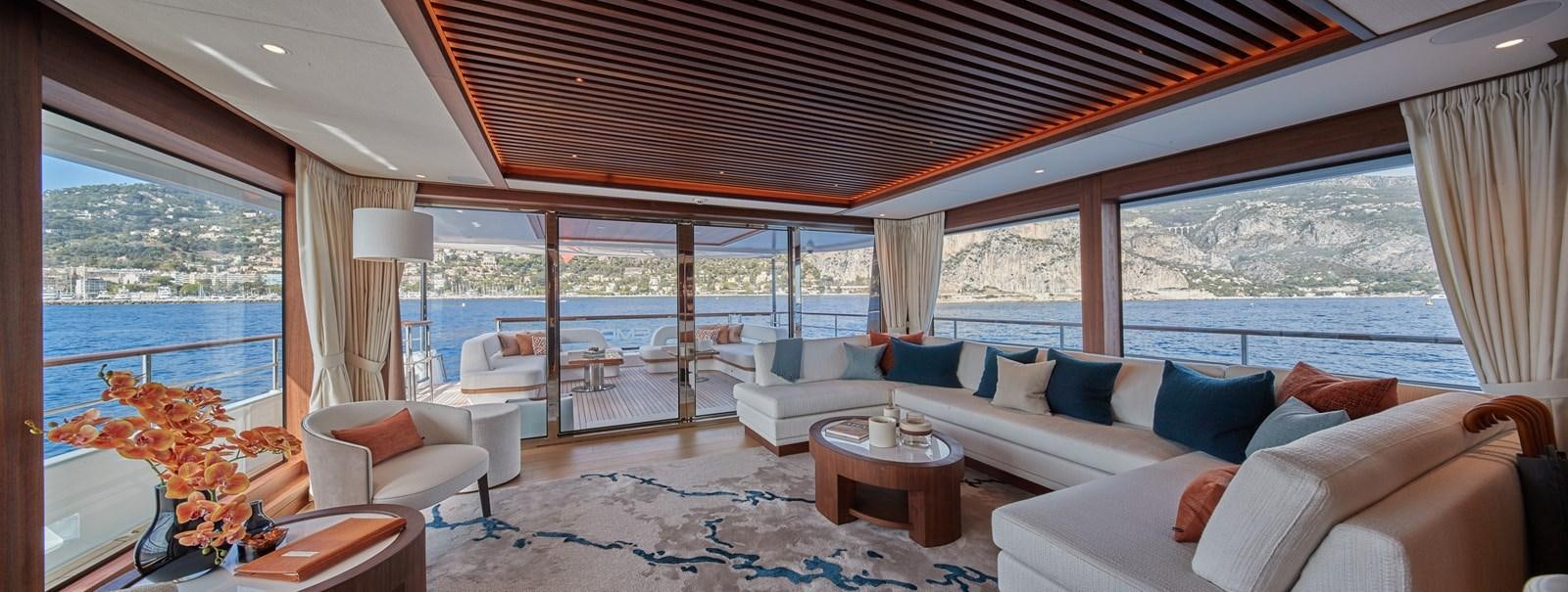 a living room with a large open window aboard SOLEMATES V Yacht for Sale