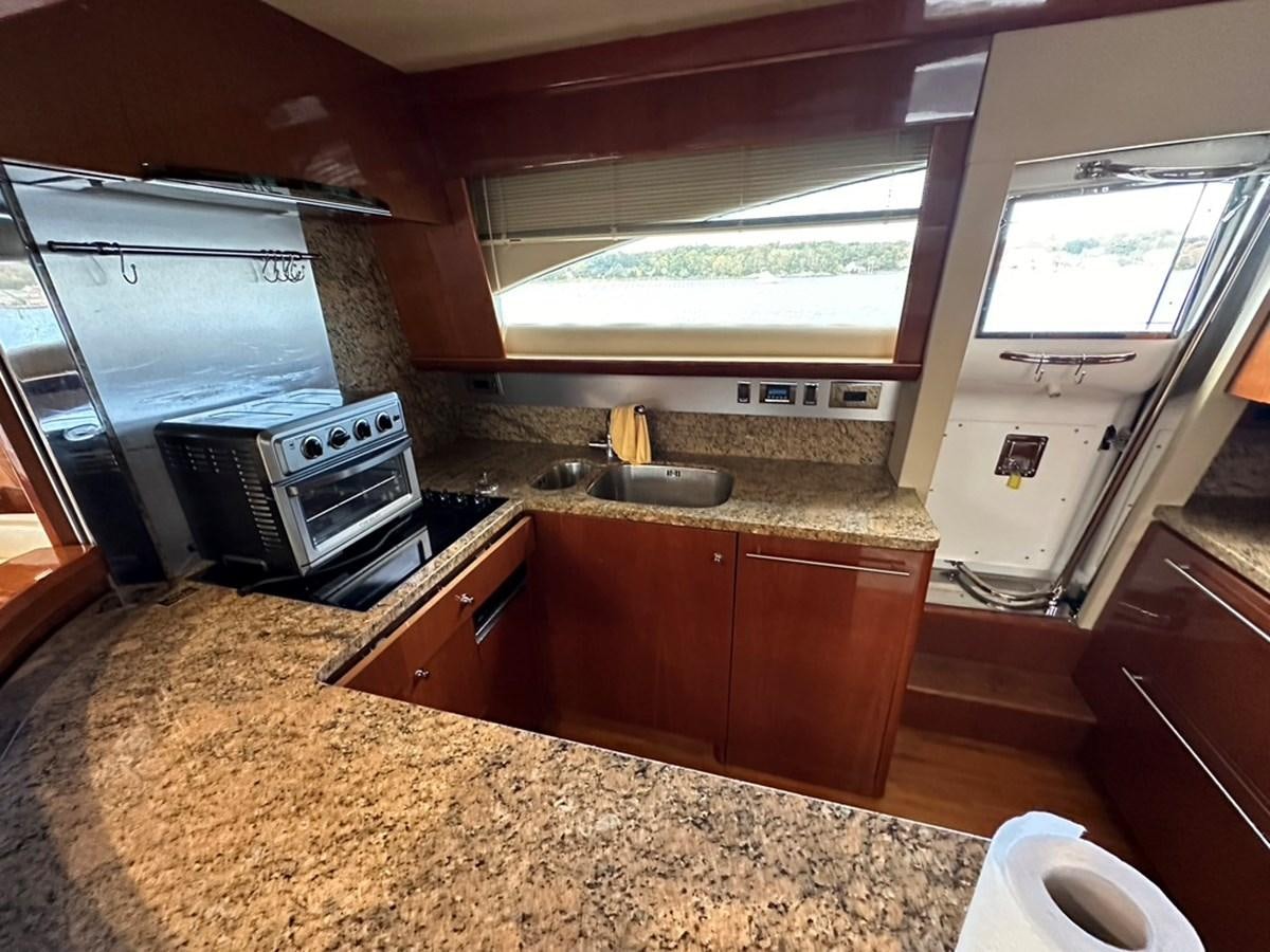 a kitchen with a large island aboard OCARALIA Yacht for Sale