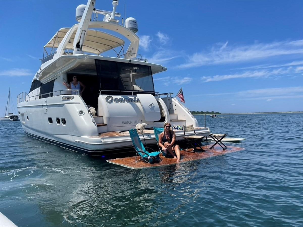 a boat with a person sitting on it in the water aboard OCARALIA Yacht for Sale