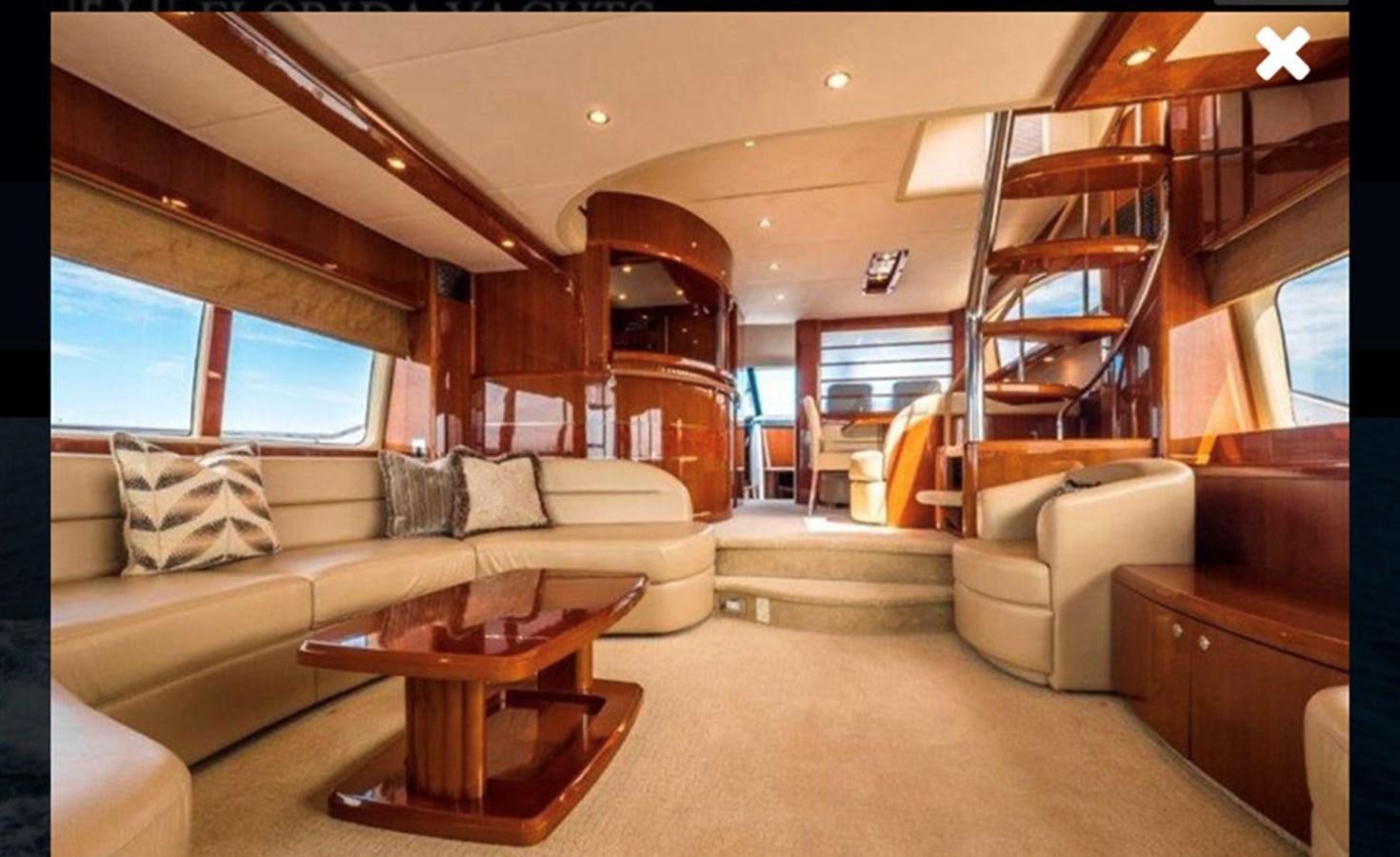 a living room with a couch and a table aboard OCARALIA Yacht for Sale