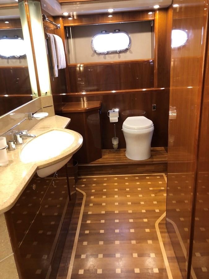 a bathroom with a toilet and sink aboard OCARALIA Yacht for Sale