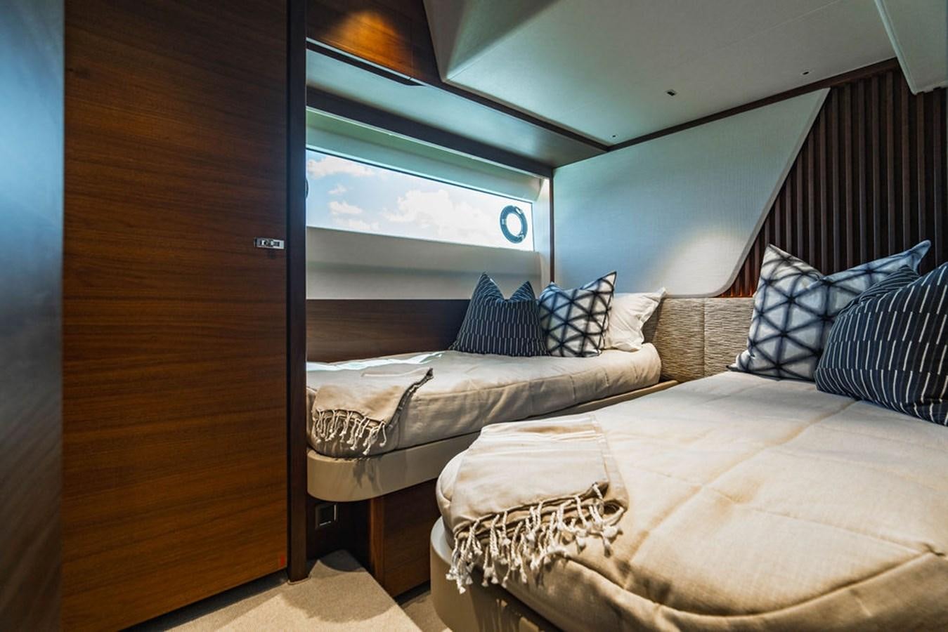 a room with two beds aboard CHAOS Yacht for Sale