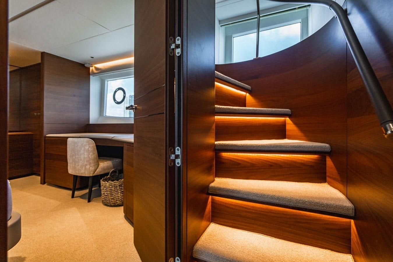 a wood door in a room aboard CHAOS Yacht for Sale