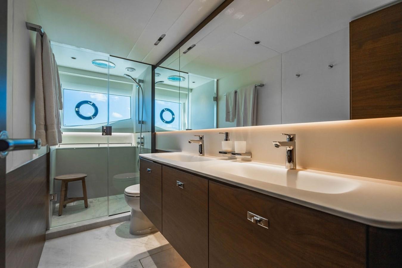a bathroom with a sink and a toilet aboard CHAOS Yacht for Sale