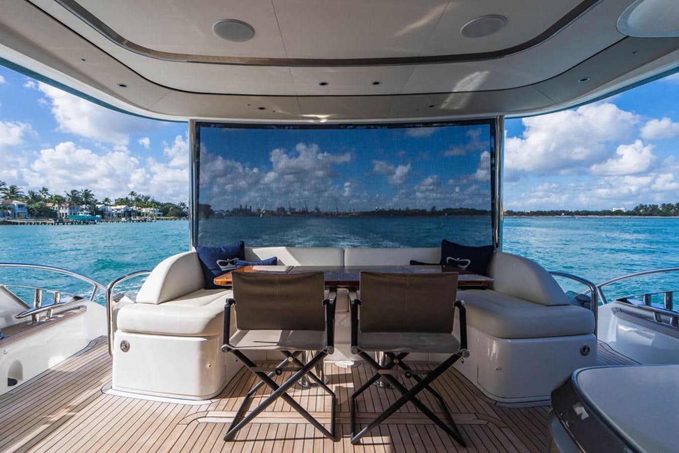 a table and chairs on a boat aboard CHAOS Yacht for Sale