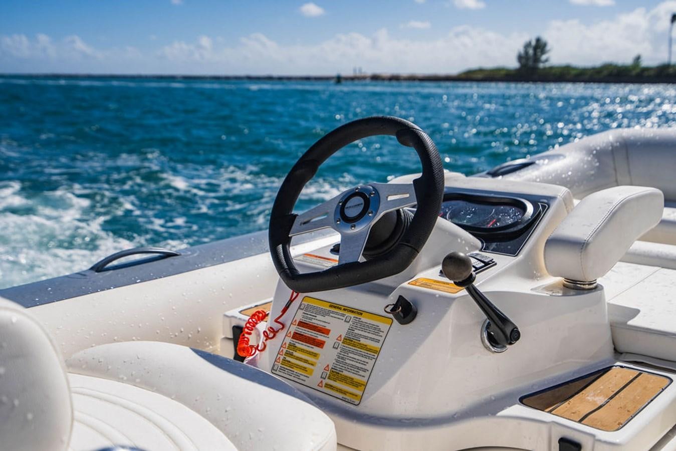 a steering wheel on a boat aboard CHAOS Yacht for Sale