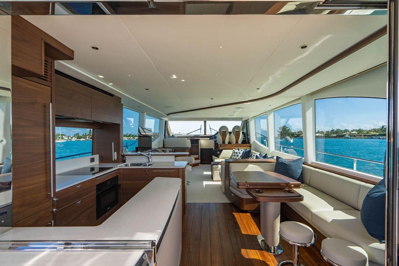 a room with a table and chairs aboard CHAOS Yacht for Sale