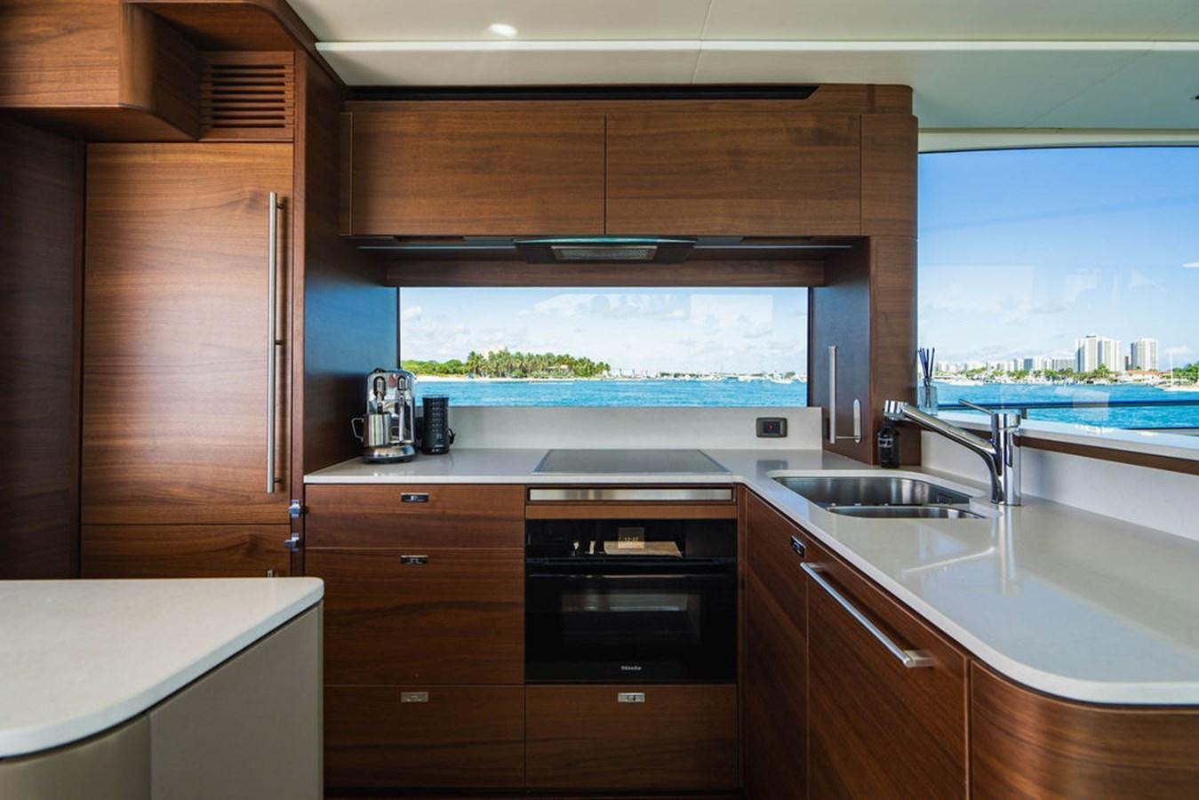 a kitchen with a large window aboard CHAOS Yacht for Sale
