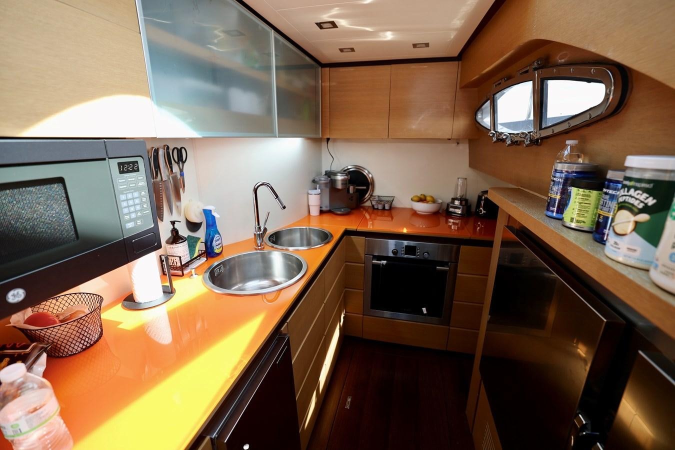a kitchen with a sink and microwave aboard MY WAY Yacht for Sale