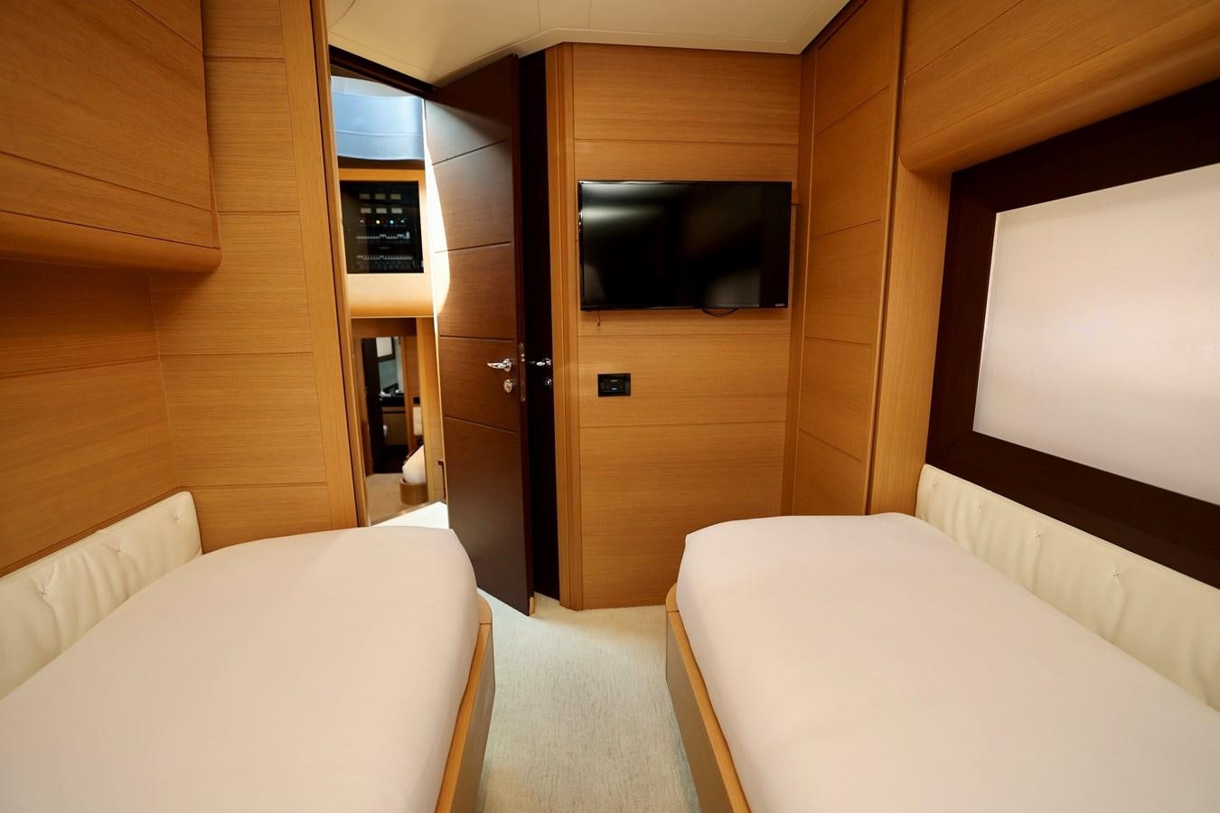 a room with a bed and a tv aboard MY WAY Yacht for Sale
