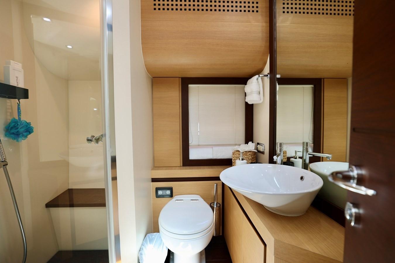 a bathroom with a sink toilet and a bathtub aboard MY WAY Yacht for Sale