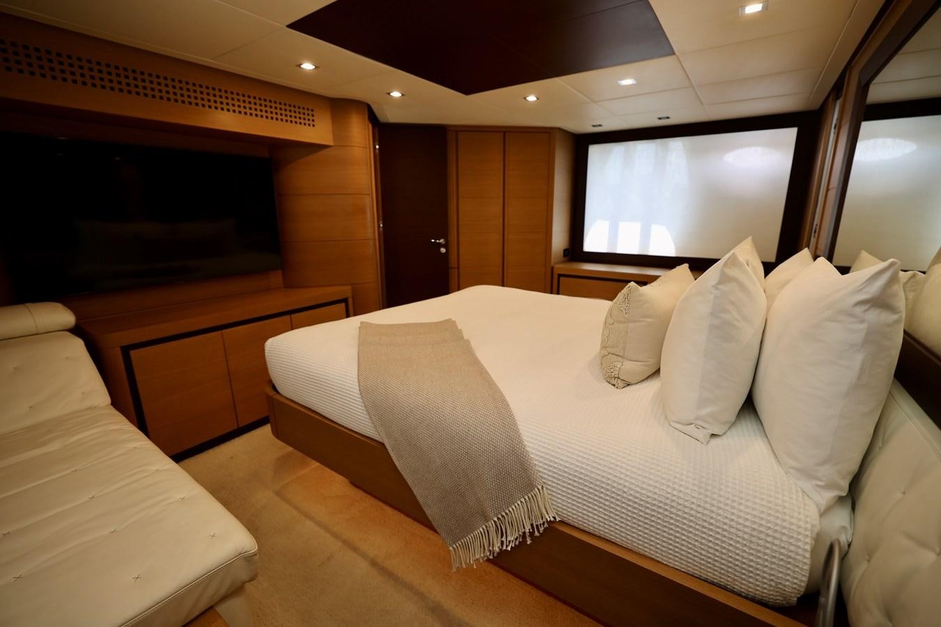 a room with a bed and a television aboard MY WAY Yacht for Sale