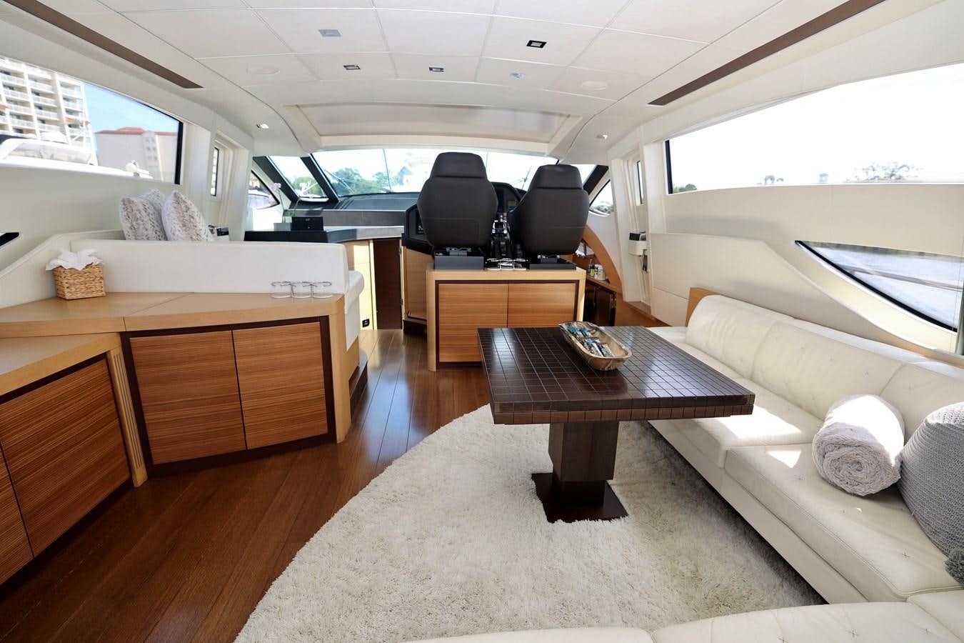 a living room with a couch and a coffee table aboard MY WAY Yacht for Sale