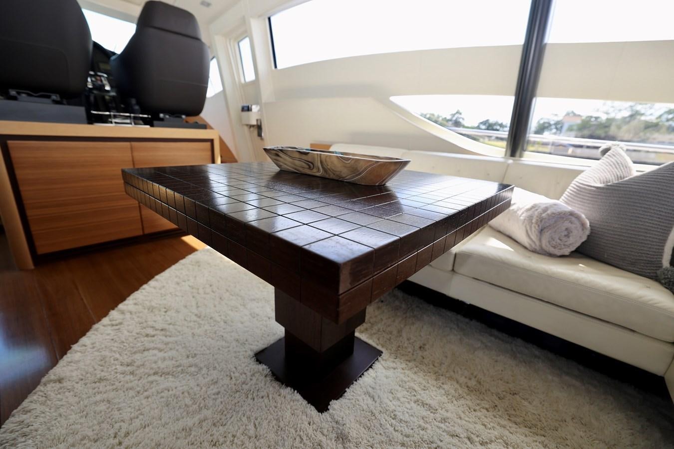 a living room with a couch and a coffee table aboard MY WAY Yacht for Sale