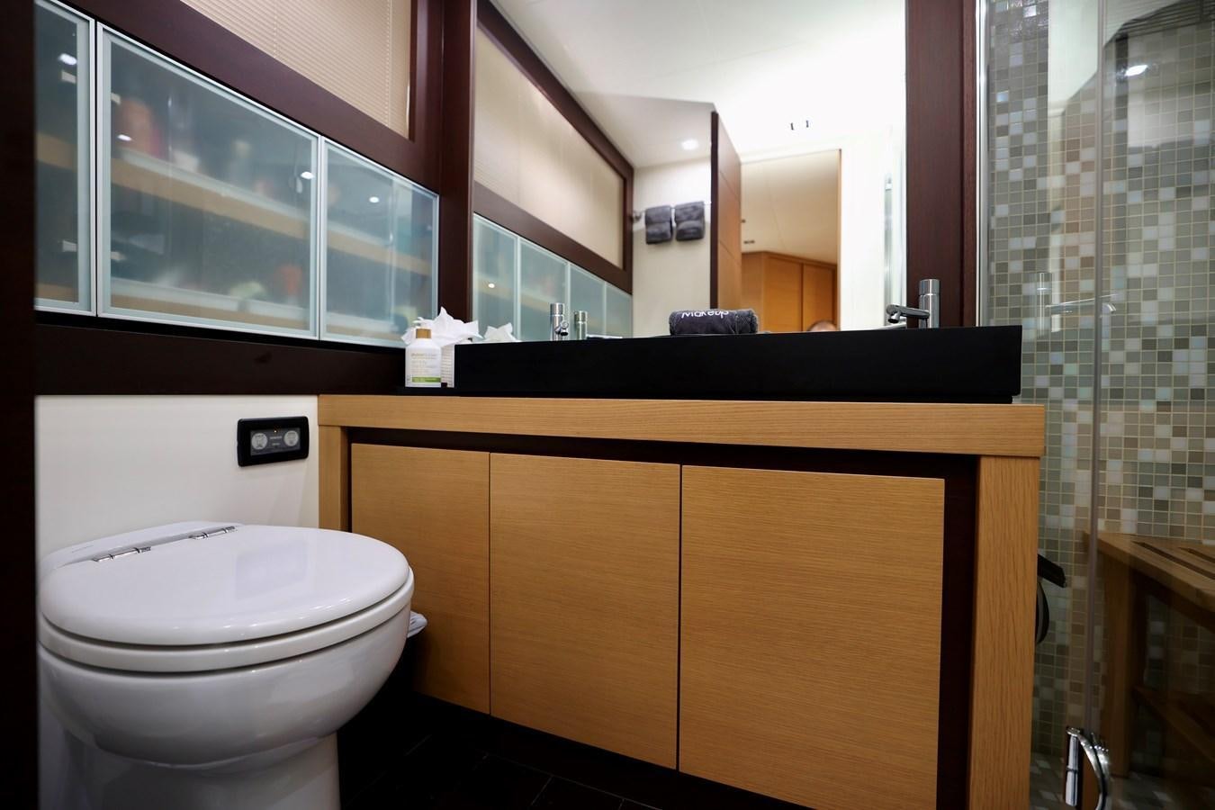 a bathroom with a toilet and a mirror aboard MY WAY Yacht for Sale