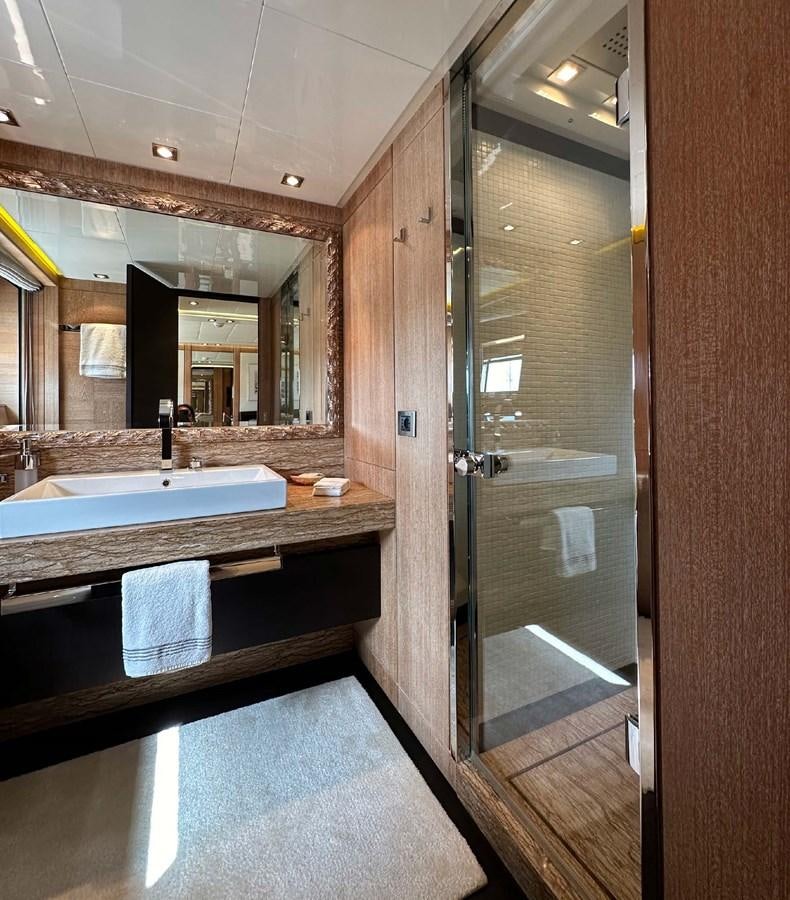 a bathroom with a large mirror aboard NINO Yacht for Sale