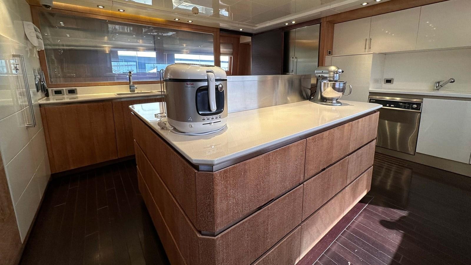 a kitchen with a coffee maker aboard NINO Yacht for Sale