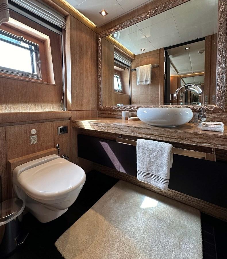 a bathroom with a toilet and sink aboard NINO Yacht for Sale