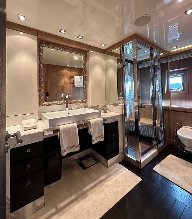a bathroom with a large mirror aboard NINO Yacht for Sale