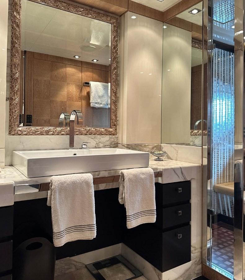 a bathroom with a large mirror aboard NINO Yacht for Sale