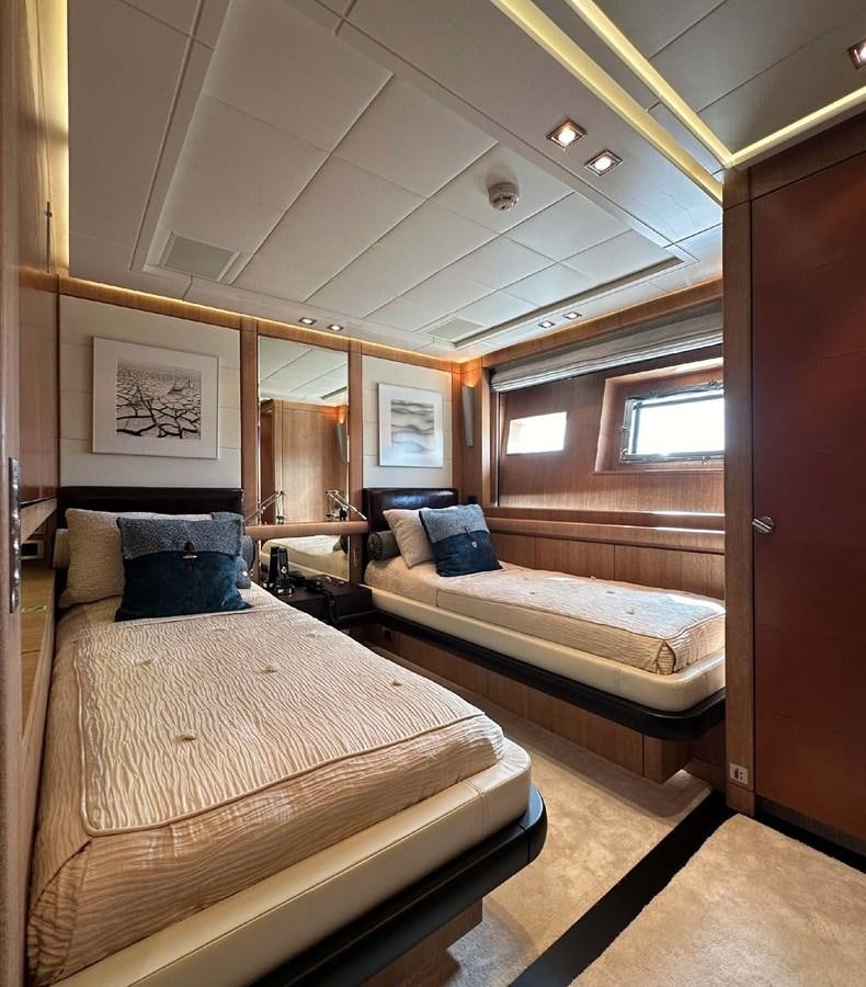 a room with a bed and a couch aboard NINO Yacht for Sale