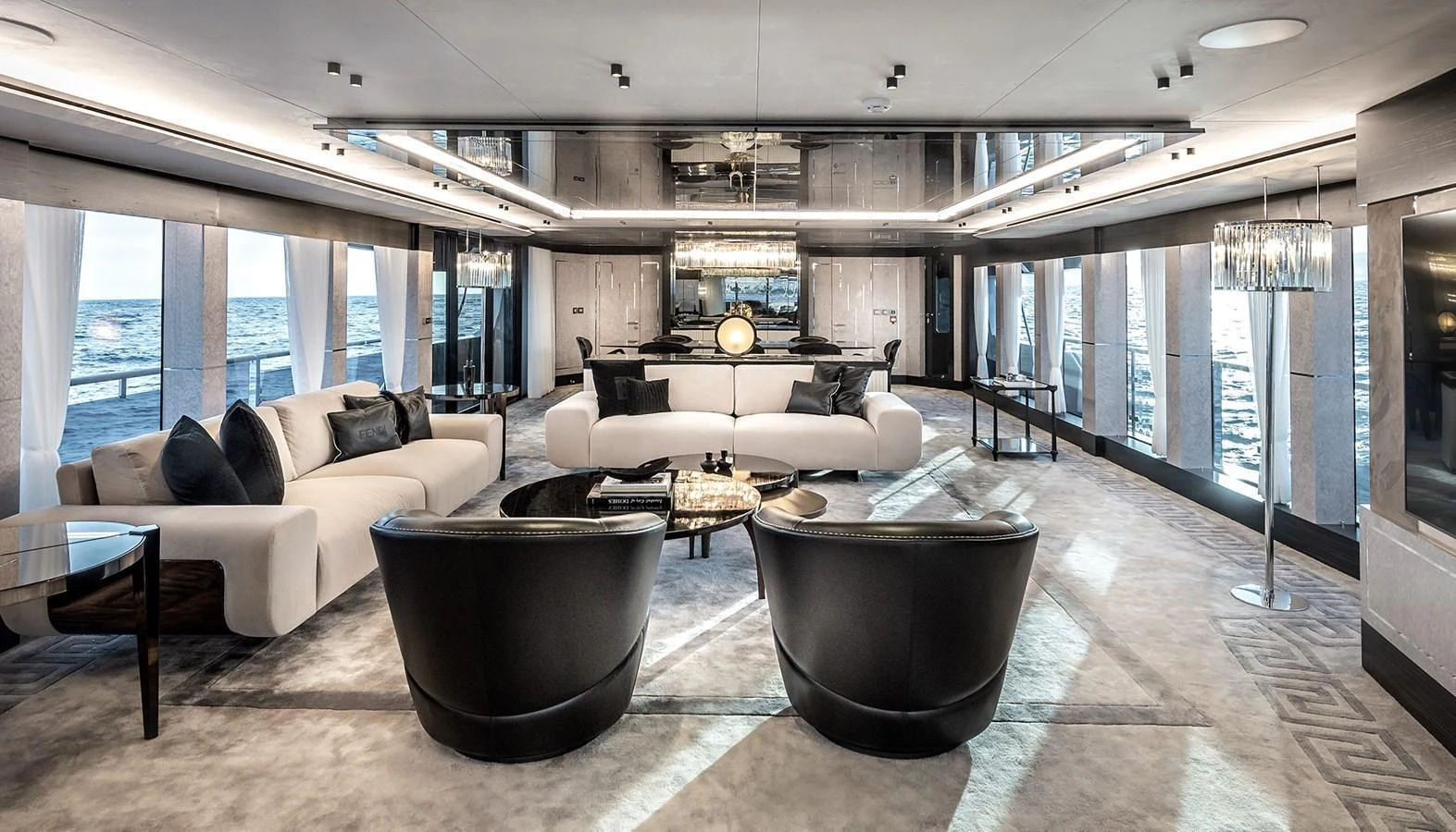 The salon features luxurious seating with panoramic ocean views and elegant decor. aboard 40MXP Yacht for Sale