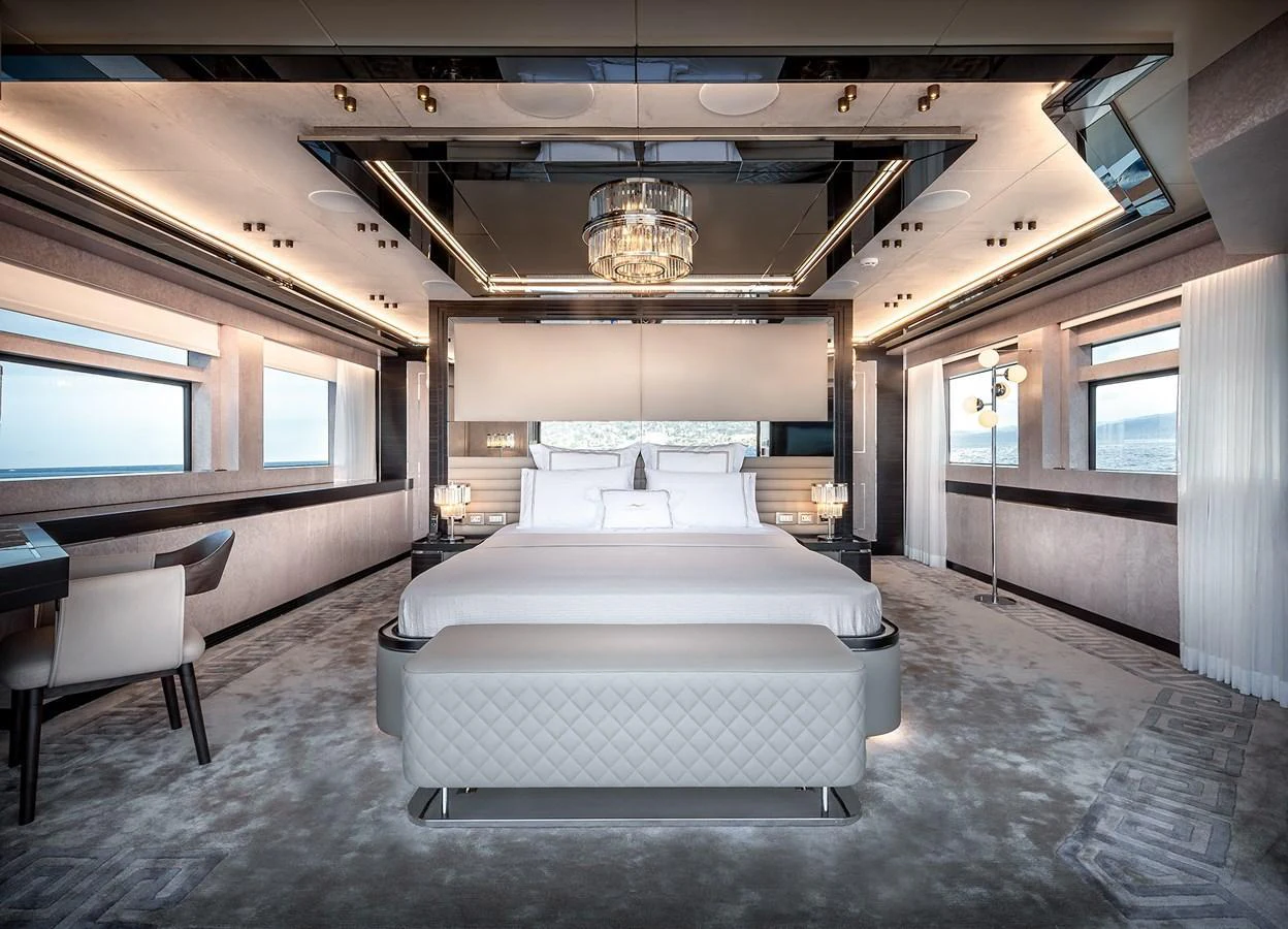 The master stateroom features a luxurious bed with elegant decor and ample natural light. aboard 40MXP Yacht for Sale