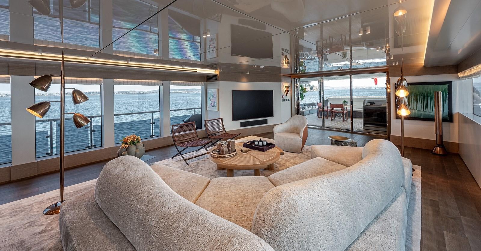 a living room with a large window aboard 37XP Yacht for Sale