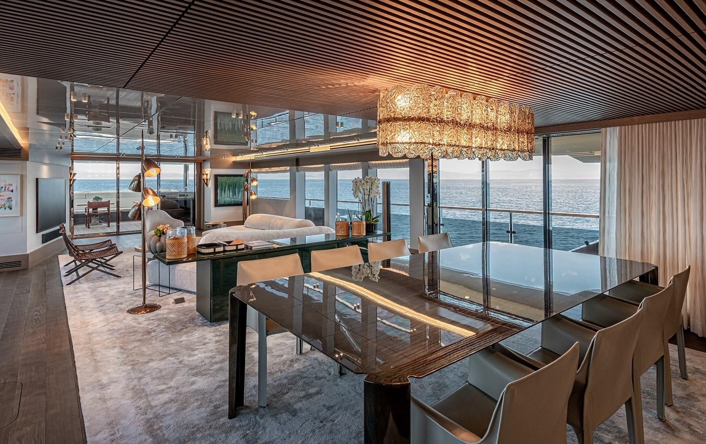 a large room with a large table and chairs aboard 37XP Yacht for Sale