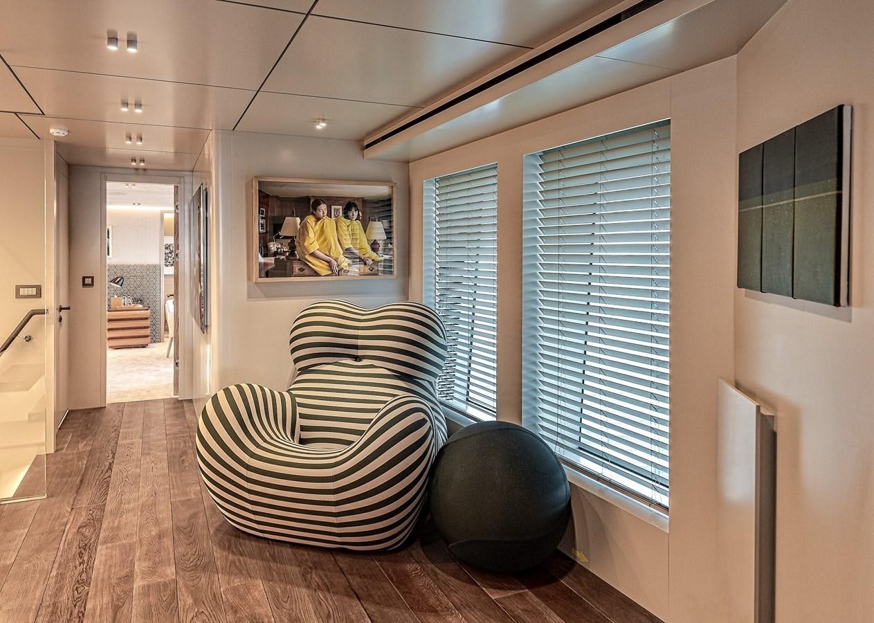 a room with a large window and a couch aboard 37XP Yacht for Sale