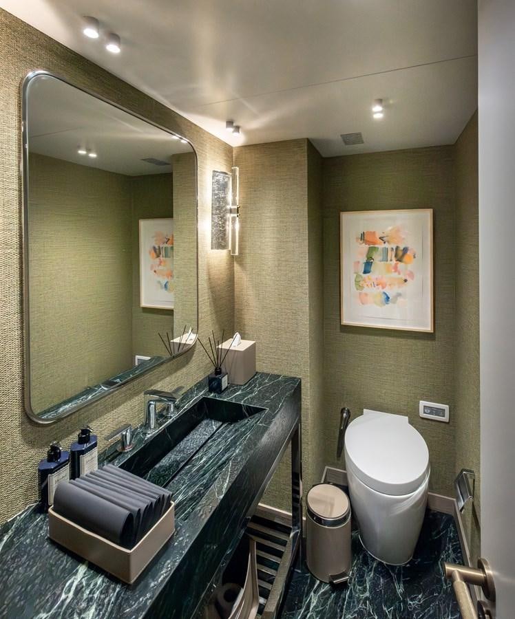 a bathroom with a large mirror aboard 37XP Yacht for Sale