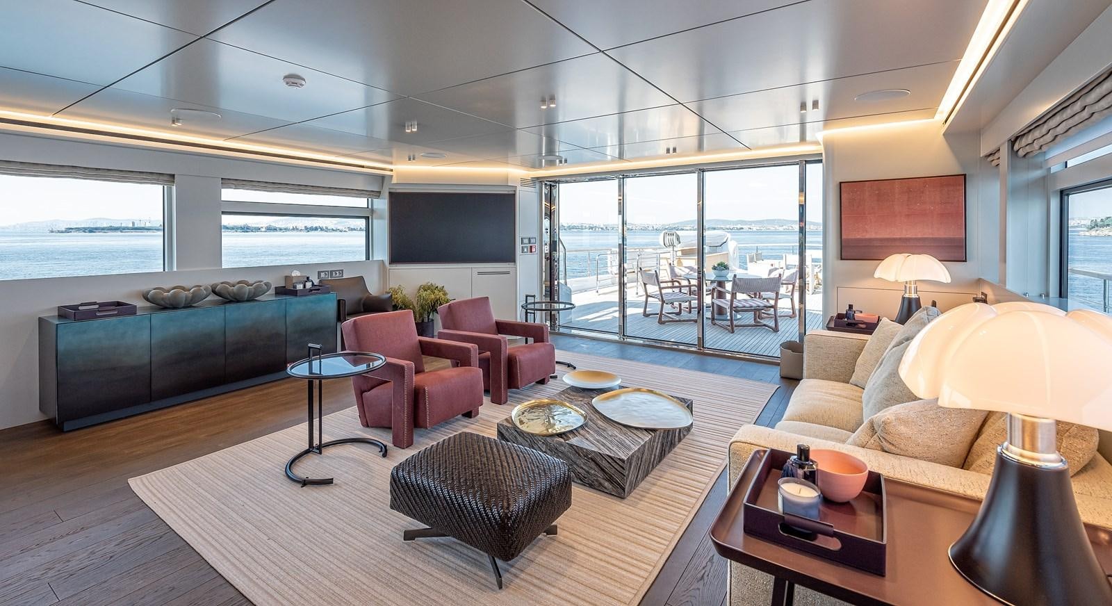 a living room with a large window aboard 37XP Yacht for Sale