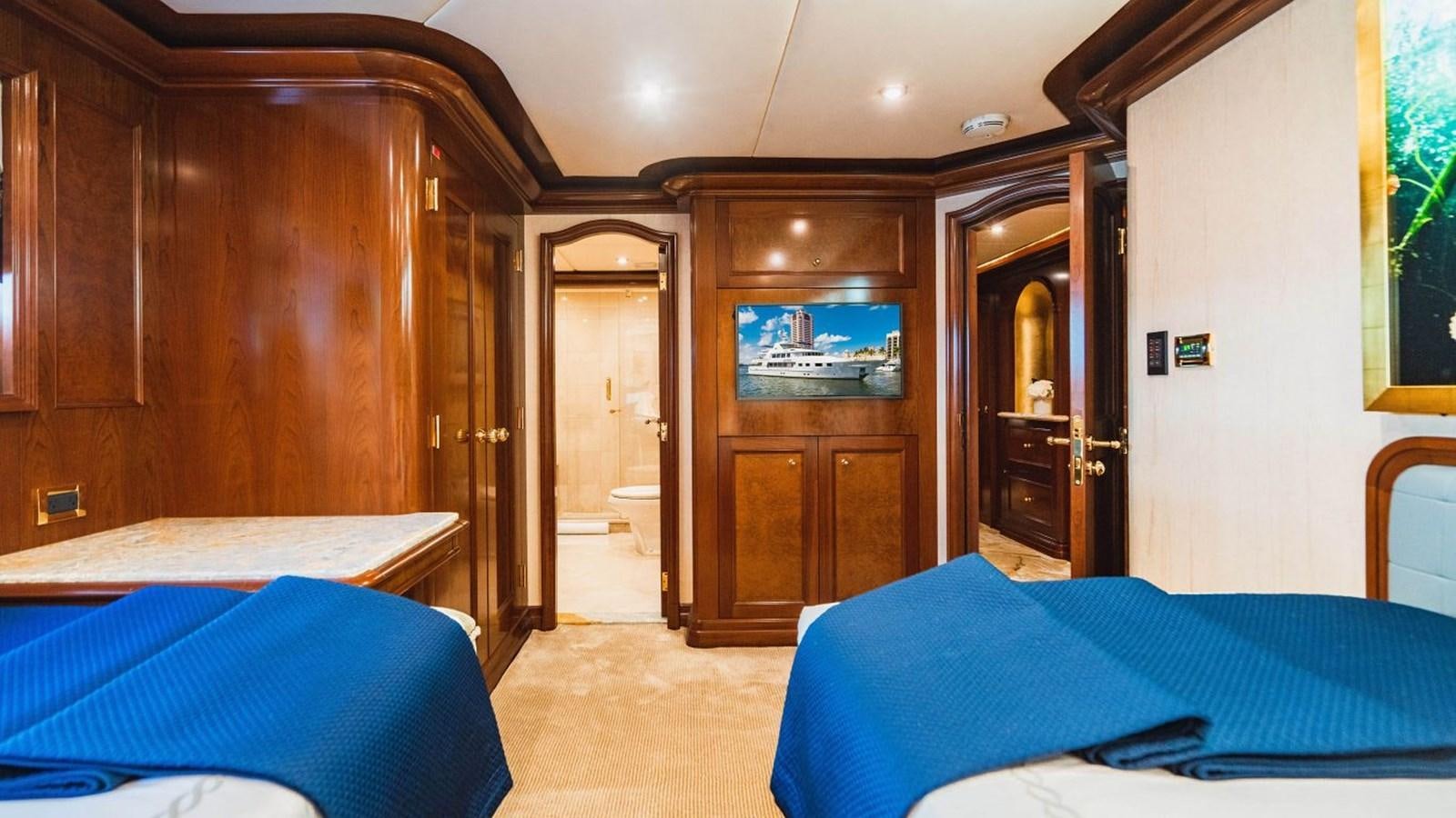 a room with a bed and a closet aboard AQUASITION Yacht for Sale
