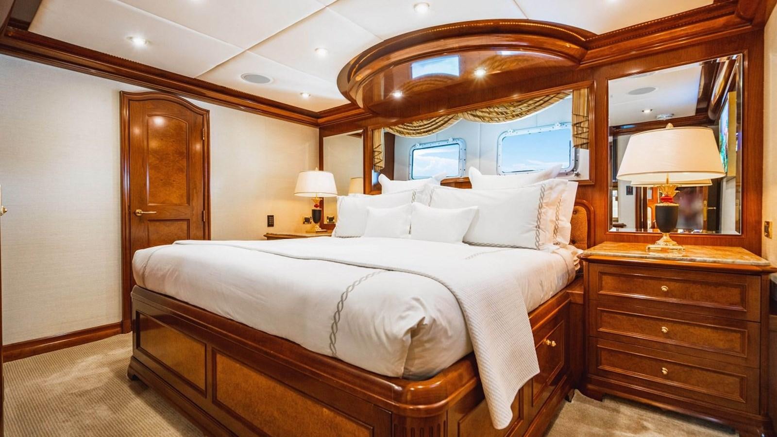 a large bed in a hotel room aboard AQUASITION Yacht for Sale