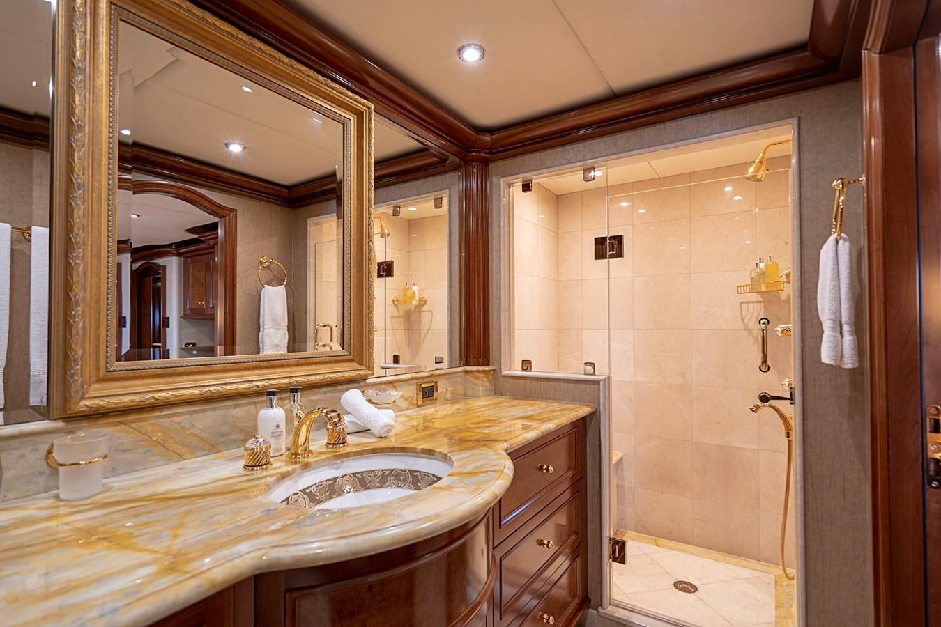 a bathroom with a large mirror aboard AQUASITION Yacht for Sale