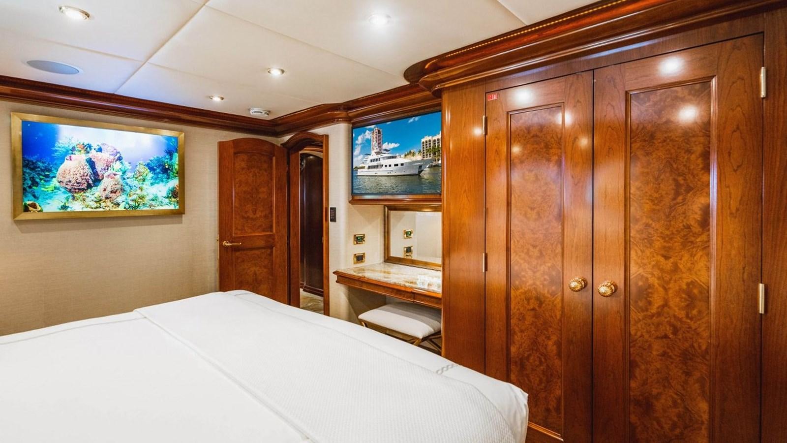 a bed and a cabinet in a room aboard AQUASITION Yacht for Sale