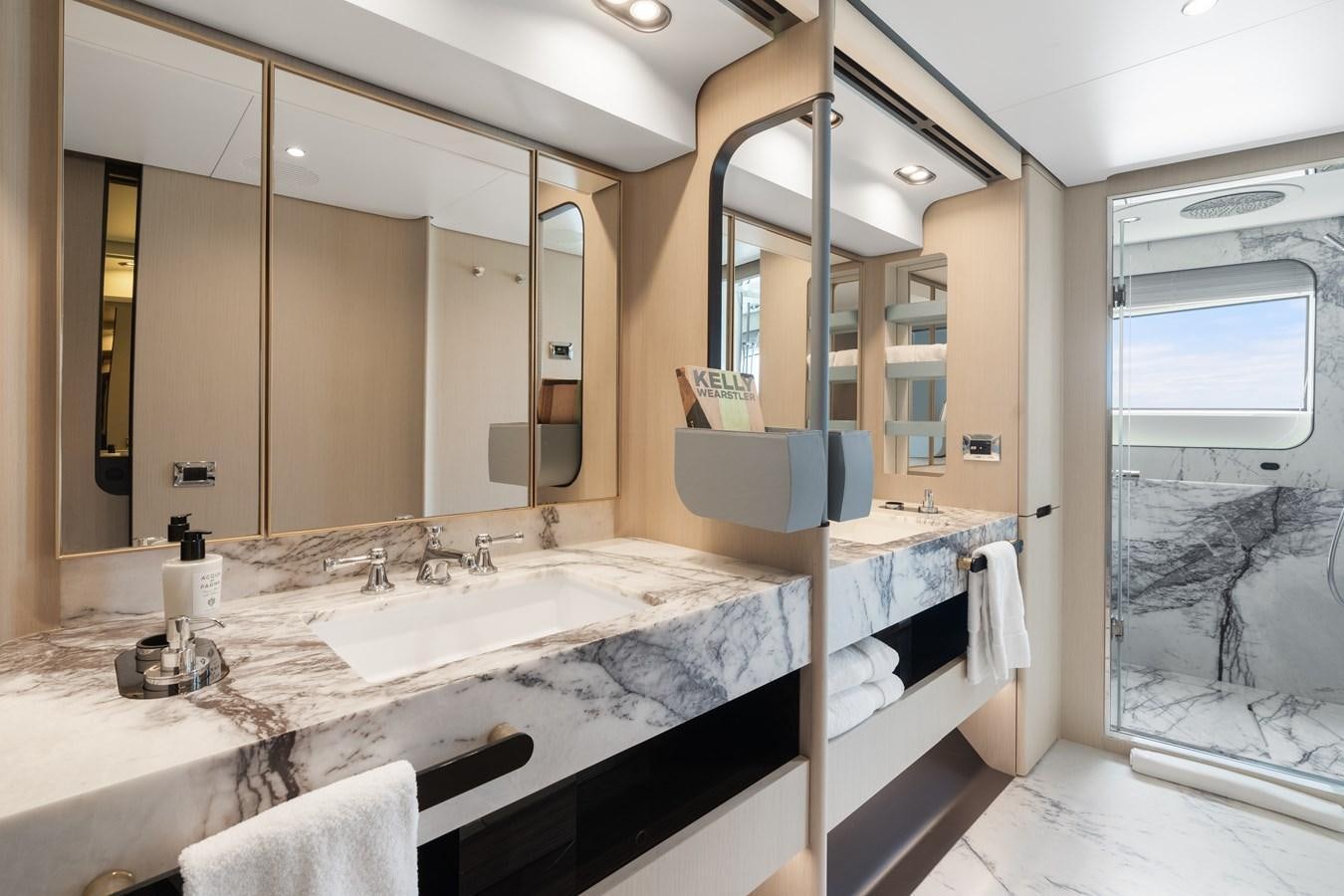 a bathroom with a large mirror aboard Y Yacht for Sale