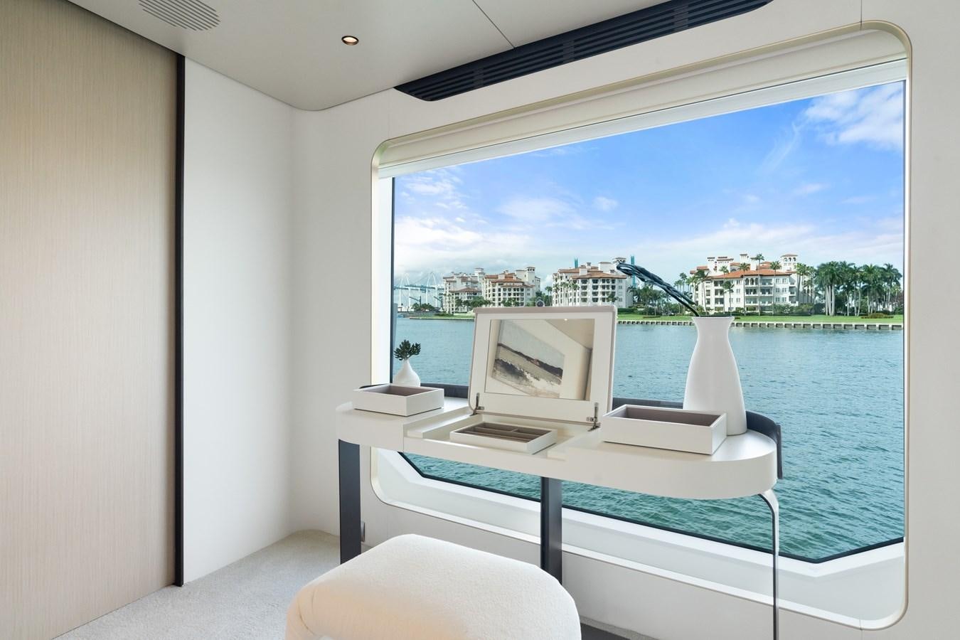 a room with a large window and a view of the city aboard Y Yacht for Sale