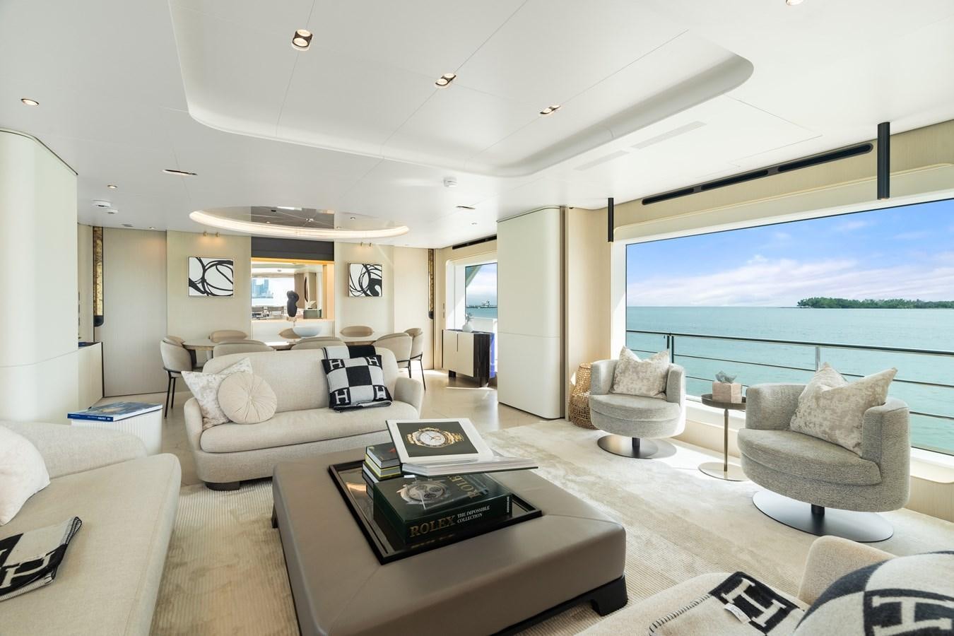 a living room with a large window aboard Y Yacht for Sale