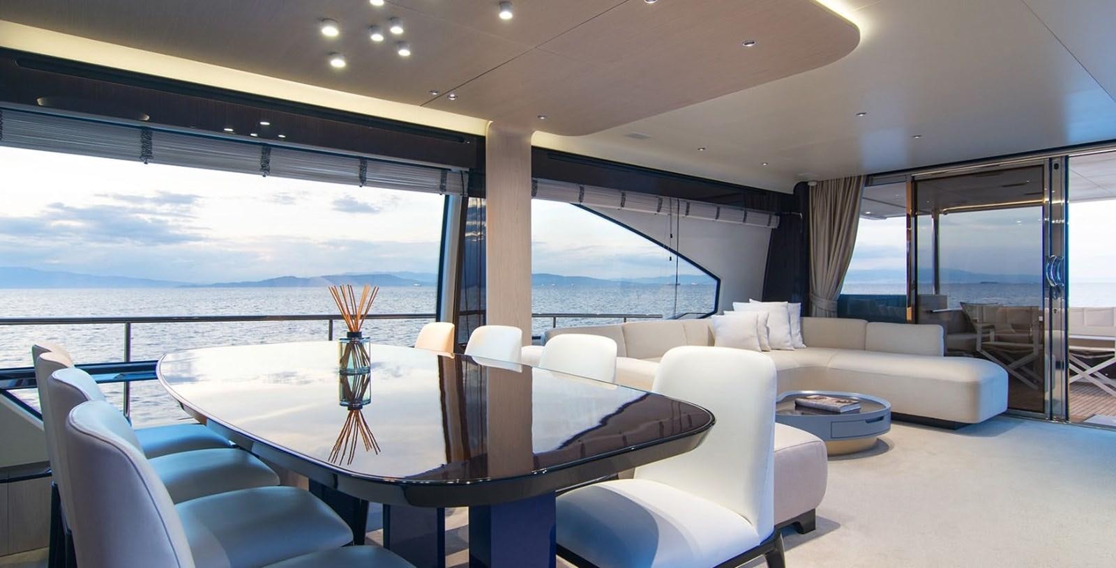 a room with a table and chairs aboard ALEX I Yacht for Sale
