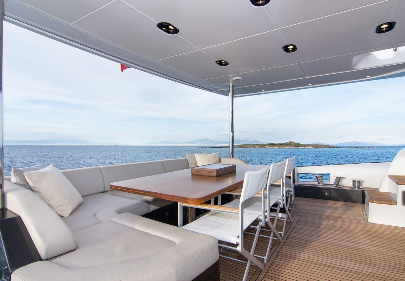 a room with a table and chairs aboard ALEX I Yacht for Sale